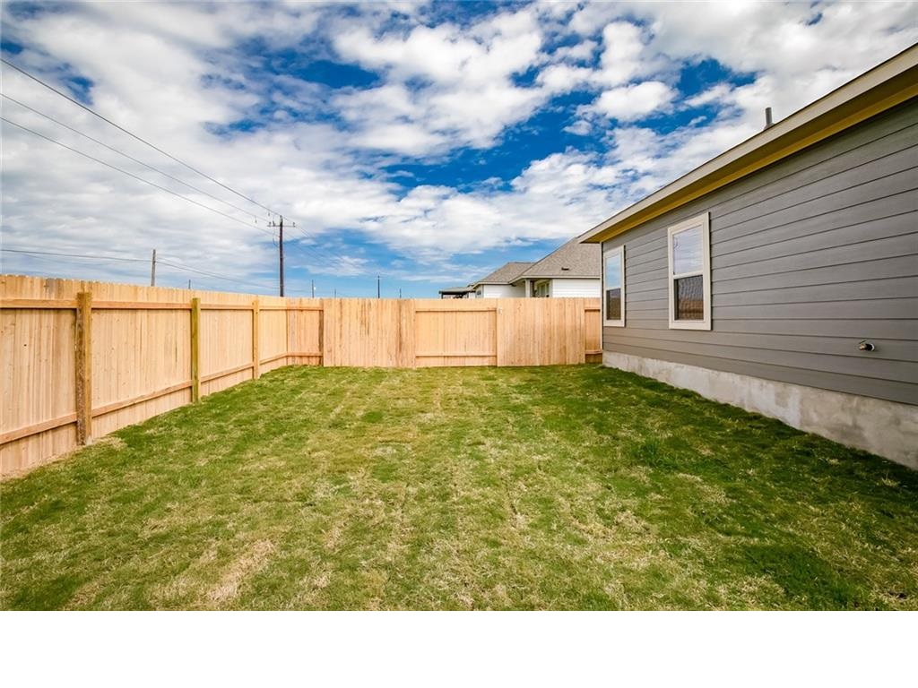 237 Unforgiven Lane Jarrell, TX 76537 - Photo 17 of 20 a black and white photo of a big room