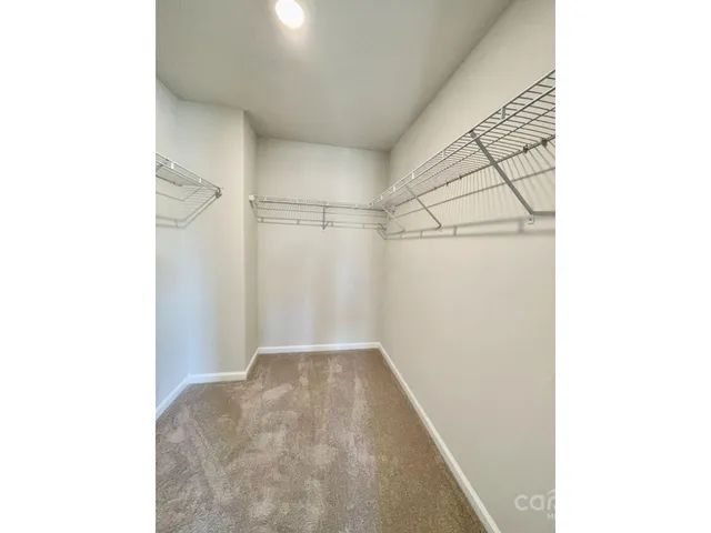 a view of a room with racks on the wall