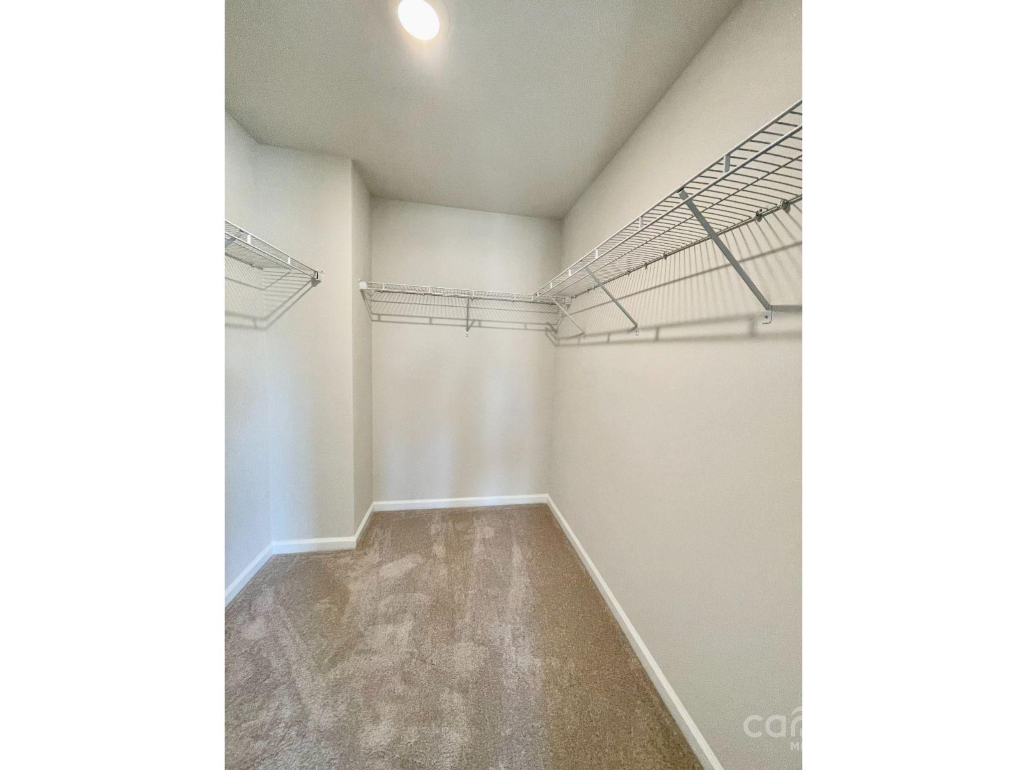 15904 Capps Road Charlotte, NC 28278 - Photo 11 of 21 a view of a room with racks on the wall