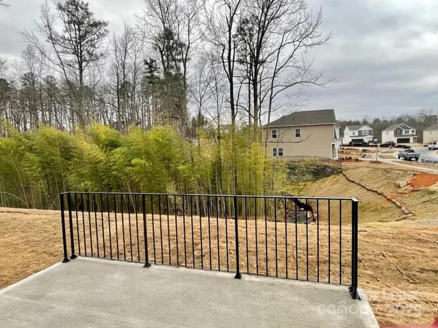 a view of a wrought iron fences in front of house