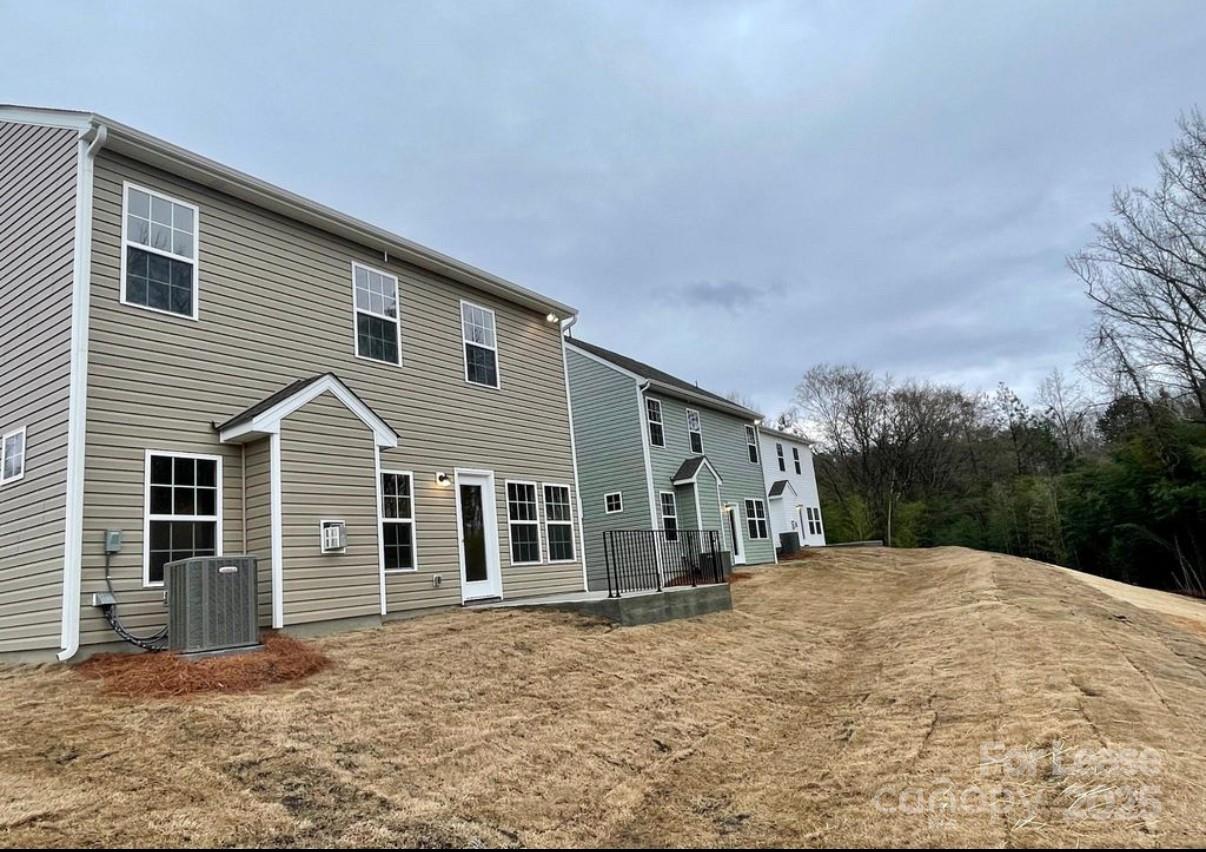 15904 Capps Road Charlotte, NC 28278 - Photo 18 of 21 a front view of a house with a yard