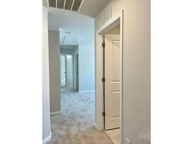 a view of a room with a hallway