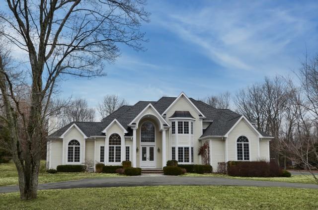 7 Fisher Lane Ridgefield, CT 06877 - Photo 1 of 1 a front view of a house with a yard