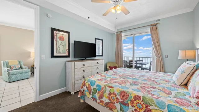 a bedroom with a bed and a flat screen tv in it