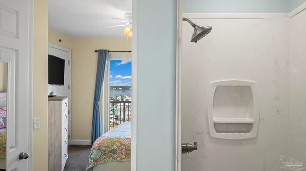 a bedroom with a bed and a view of bathroom