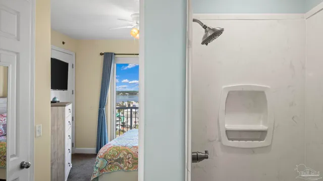a bedroom with a bed and a view of bathroom