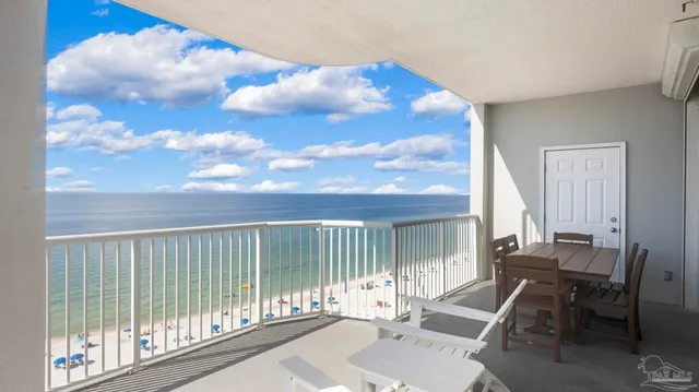 a view of a balcony with chair and table