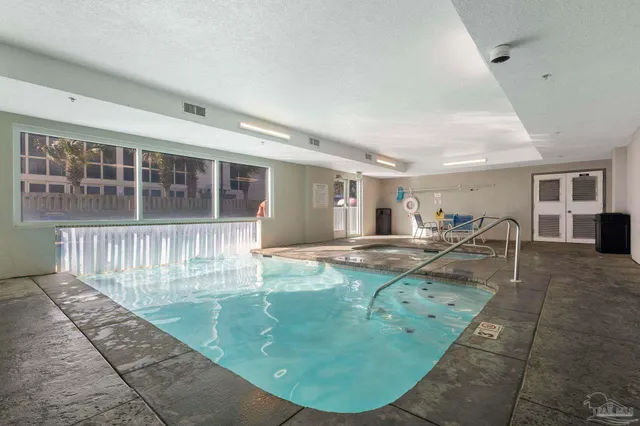a view of a livingroom with furniture and a table