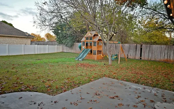 a view of a backyard with a slide