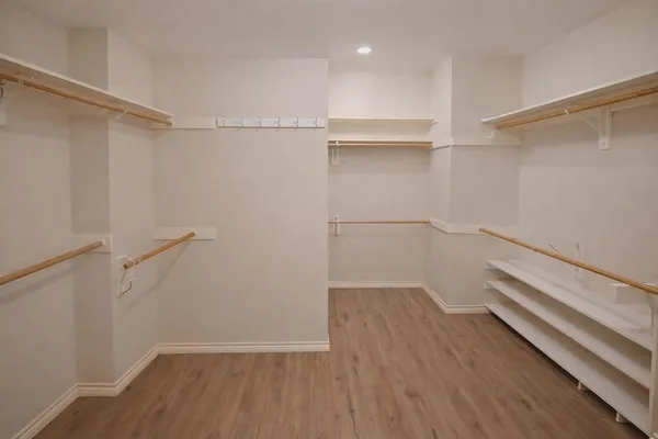 a view of an empty walk in closet