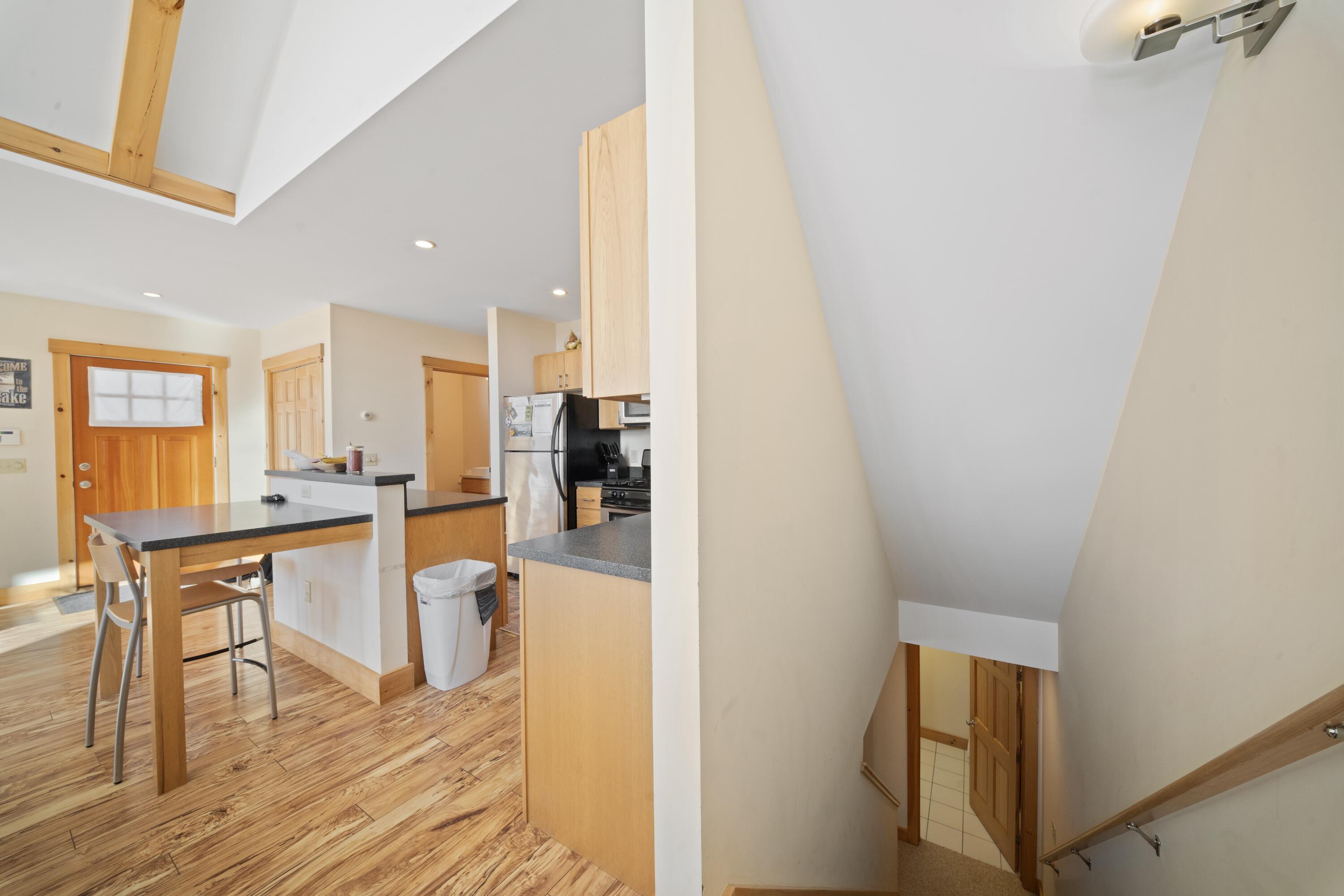 42 Whip Willow Farm Road, Unit 19 Rangeley, ME 04970 - Photo 30 of 51 Kitchen and Stairs