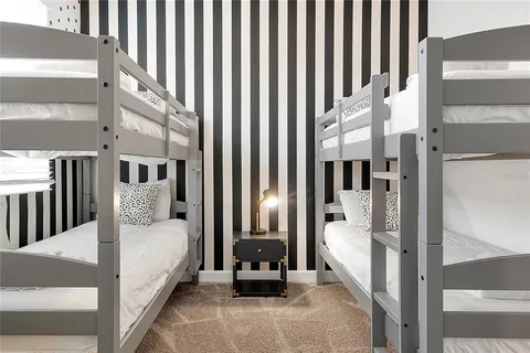 a living room with furniture a rug and a window