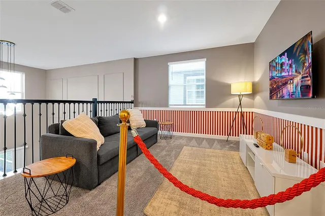 a living room with furniture and a window