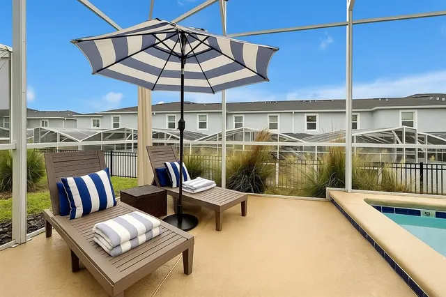 a view of a balcony with chairs