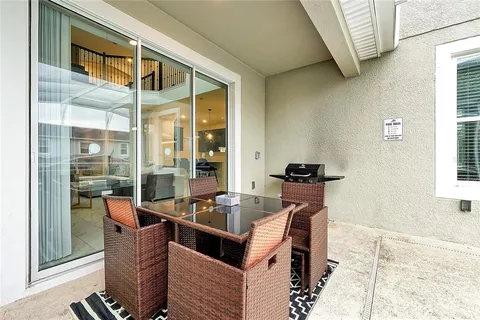 a view of swimming pool with outdoor seating