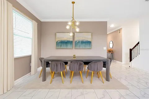 a kitchen with stainless steel appliances granite countertop a sink a stove a refrigerator and island