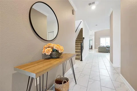 a kitchen with a sink appliances and cabinets