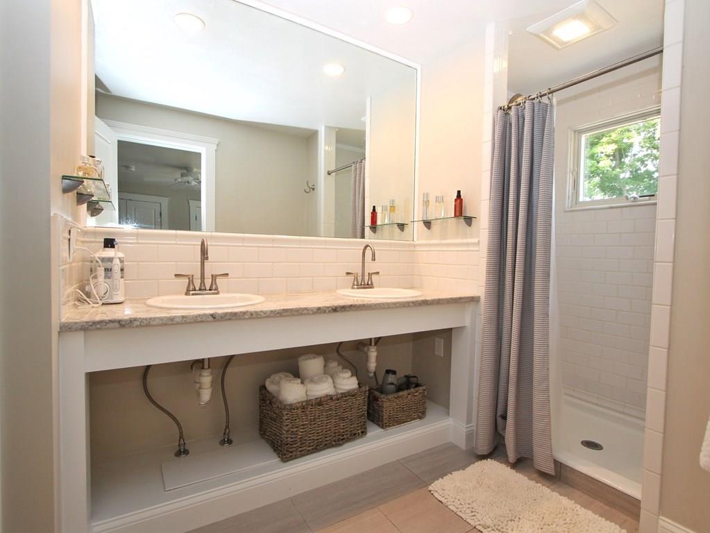 4 Ashmore Road Worcester, MA 01602 - Photo 14 of 38 a bathroom with a sink and a mirror