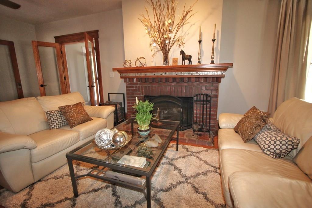 4 Ashmore Road Worcester, MA 01602 - Photo 4 of 38 a living room with furniture and a fireplace