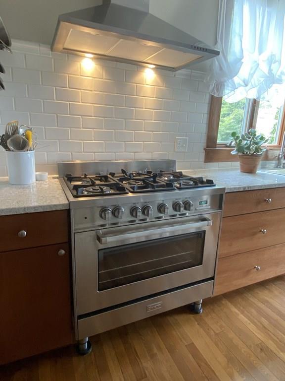 4 Ashmore Road Worcester, MA 01602 - Photo 8 of 38 a stove top oven sitting inside of a kitchen