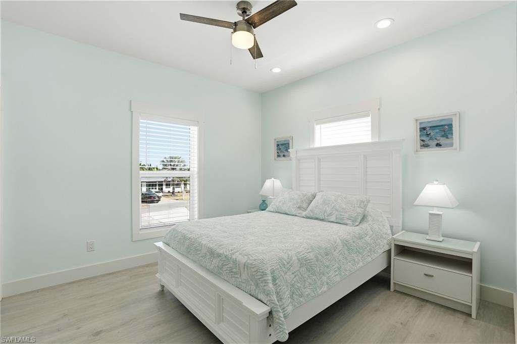 1 Fairview Boulevard Fort Myers Beach, FL 33931 - Photo 14 of 48 a bedroom with a bed and a window