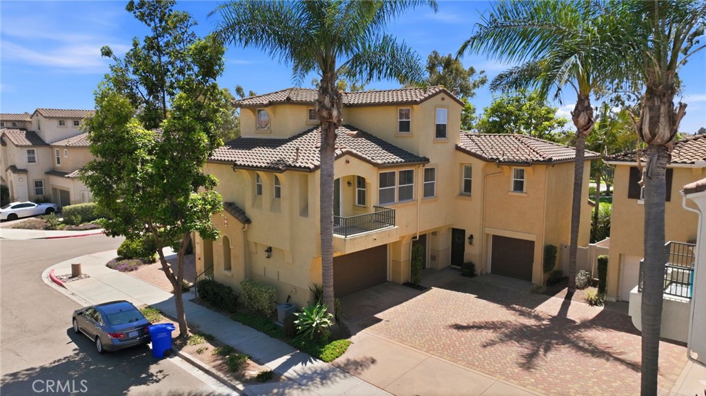 3603 Jetty Carlsbad, CA 92010 - Photo 33 of 43 a view of a white house with a yard and sitting area