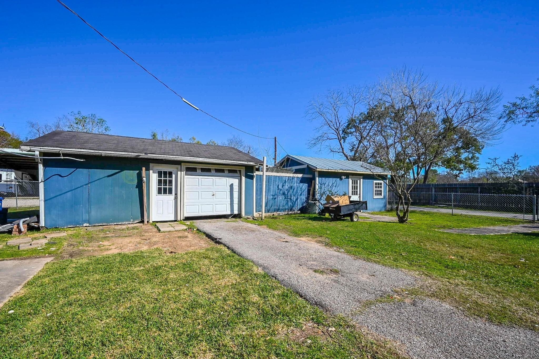 18910 Carrot Street Spring, TX 77379 - Photo 14 of 48 a front view of a house with a yard and trees