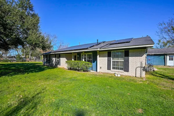 a front view of house with yard and green space