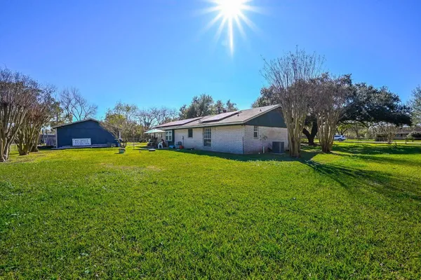 a view of a house with a big yard
