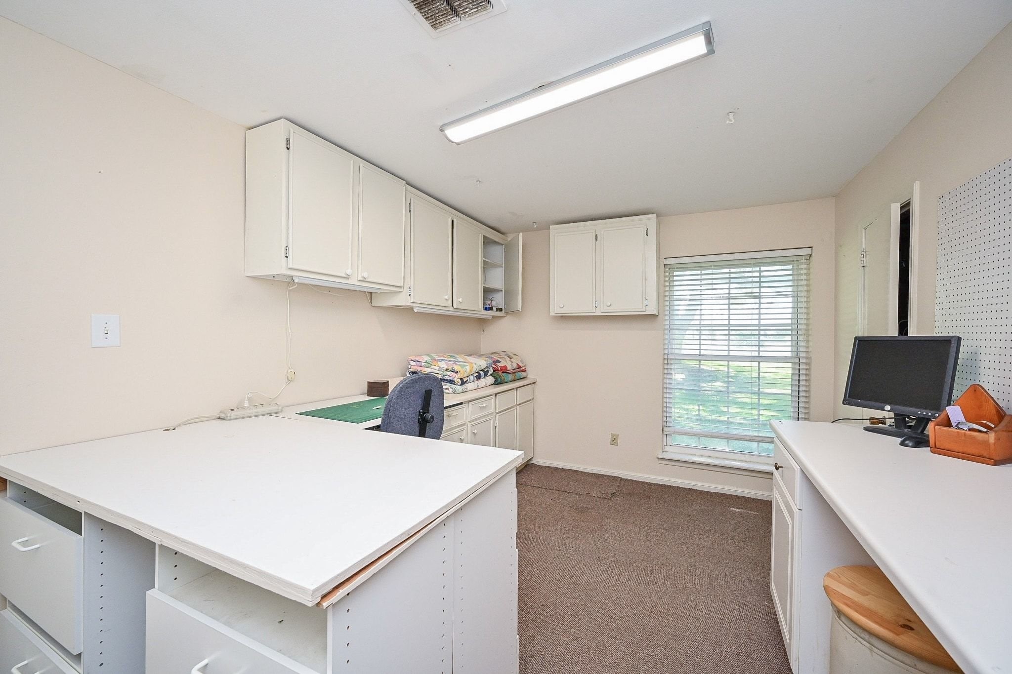 18910 Carrot Street Spring, TX 77379 - Photo 26 of 48 a view of a kitchen with workspace and a window