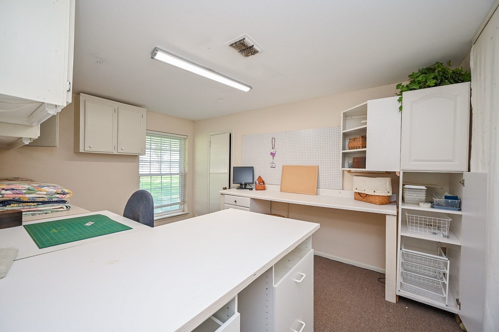 18910 Carrot Street Spring, TX 77379 - Photo 28 of 48 a living room with stainless steel appliances furniture a rug and a window