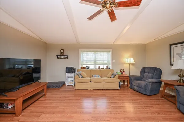 a living room with furniture and a window