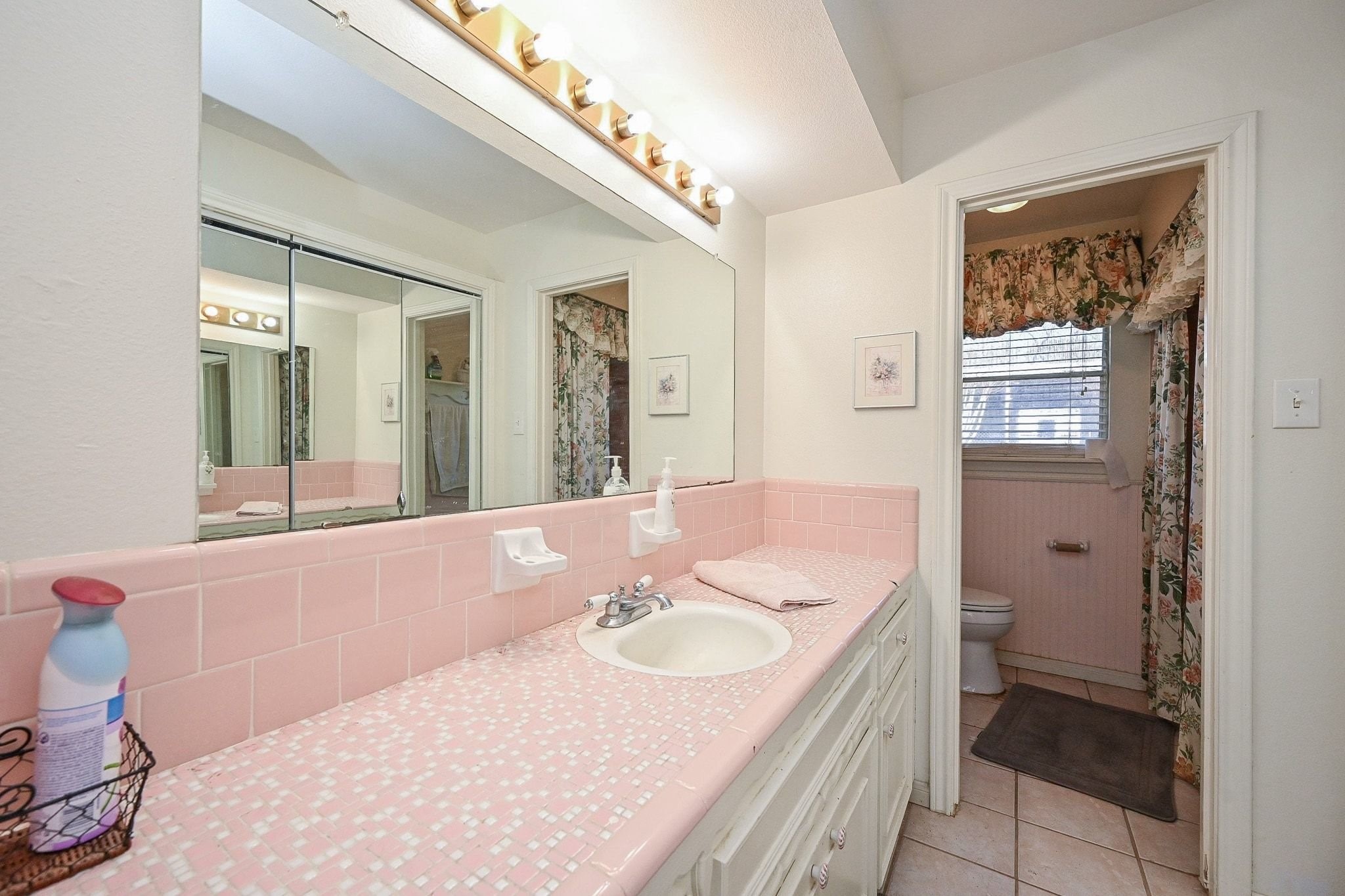 18910 Carrot Street Spring, TX 77379 - Photo 31 of 48 a bathroom with a tub sink and mirror