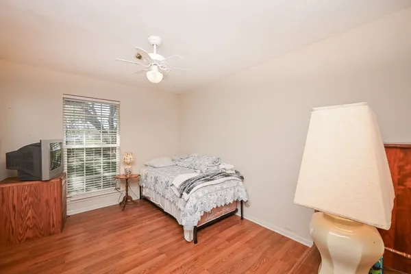 a bedroom with a bed furniture and a window