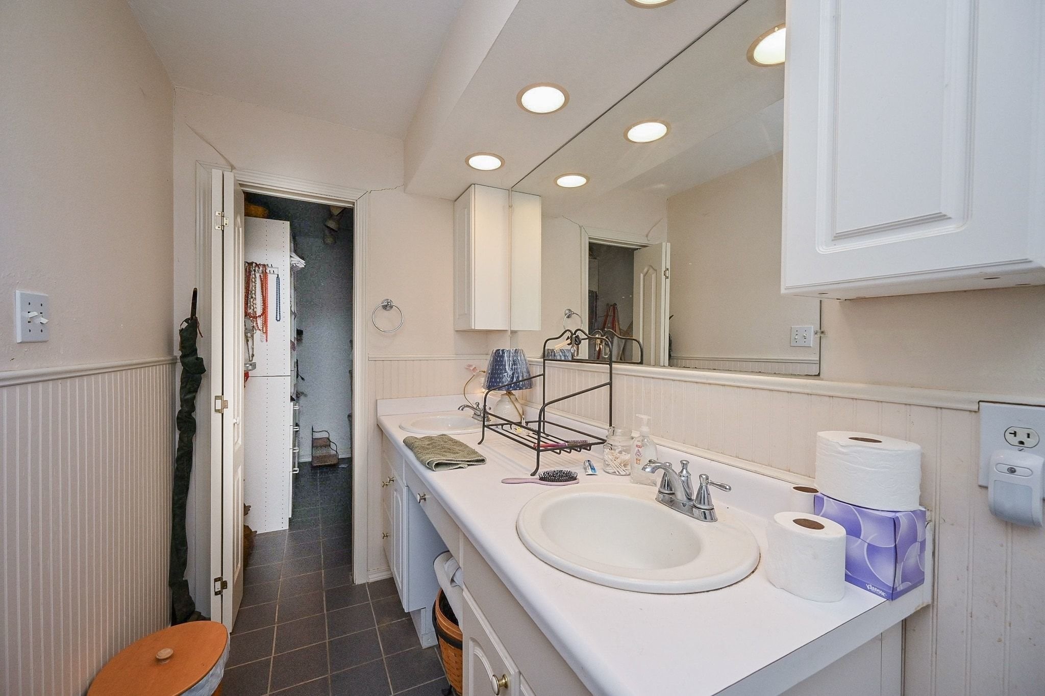 18910 Carrot Street Spring, TX 77379 - Photo 35 of 48 a bathroom with a sink double vanity and a toilet