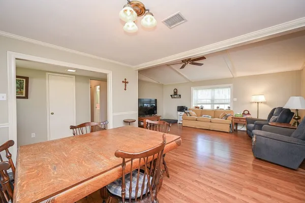a kitchen with granite countertop a refrigerator and a sink
