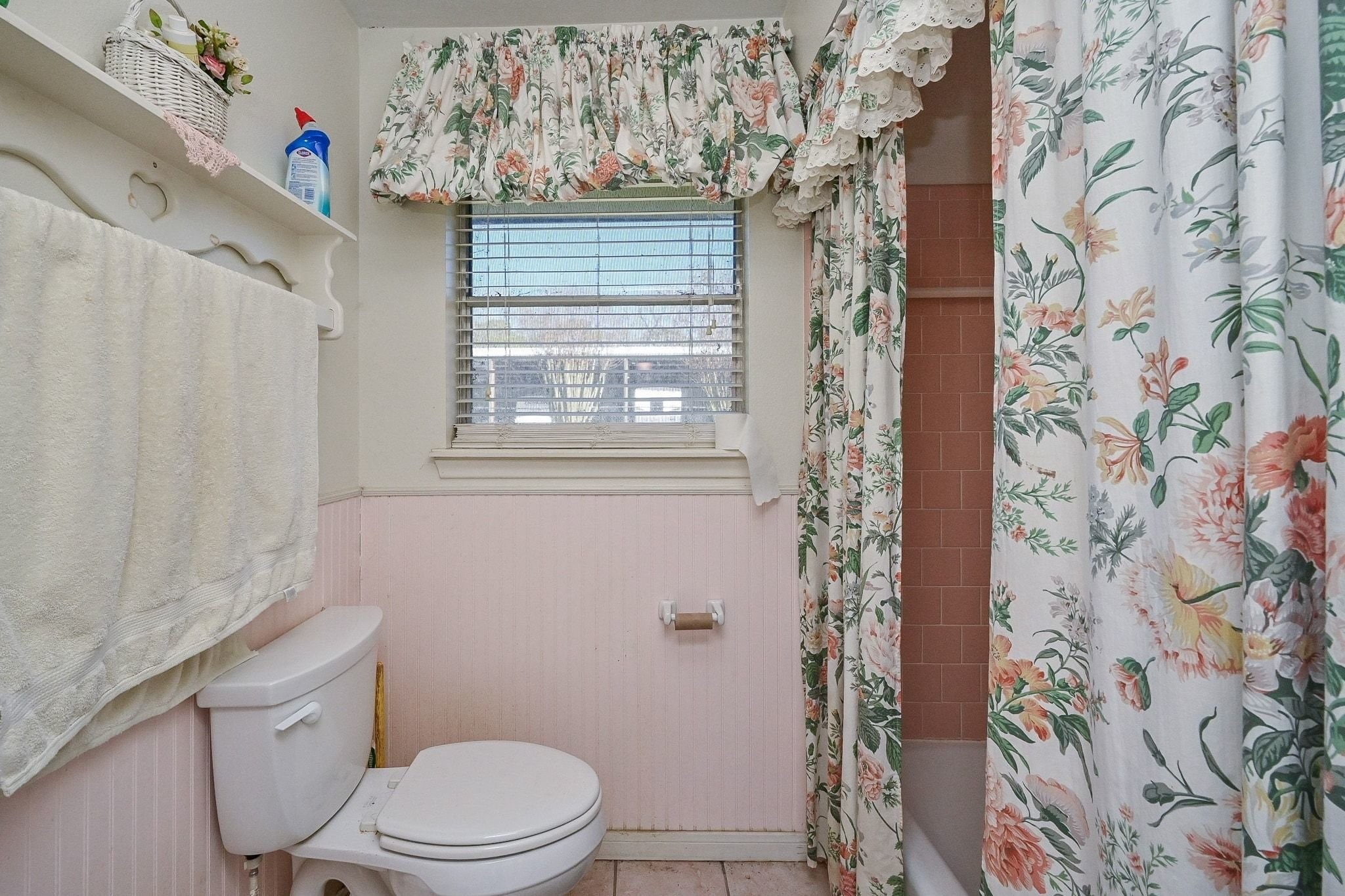 18910 Carrot Street Spring, TX 77379 - Photo 46 of 48 a white toilet sitting next to a shower curtain