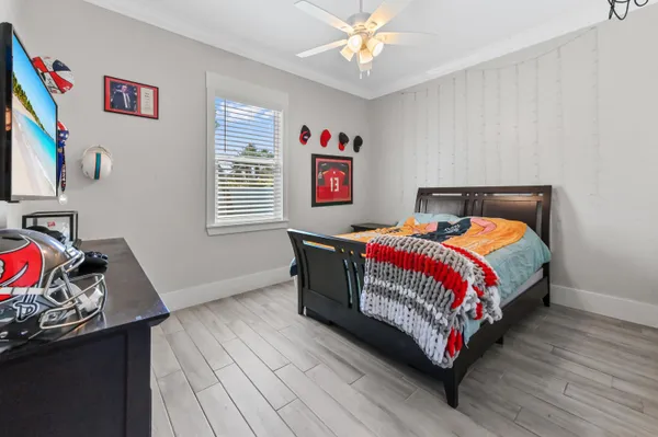 a bedroom with bed and a window