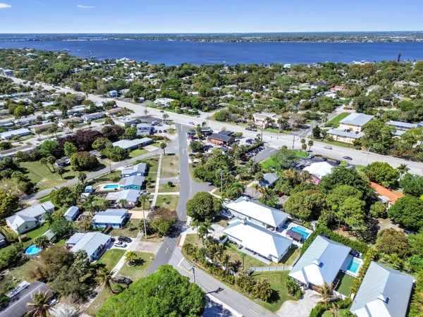 an aerial view of residential houses with outdoor space