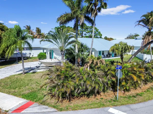 a view of a backyard with sitting area