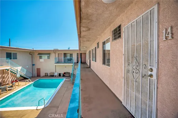 a view of a backyard with table and chairs