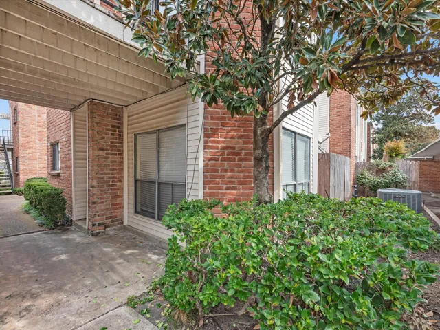 a view of a house with a tree