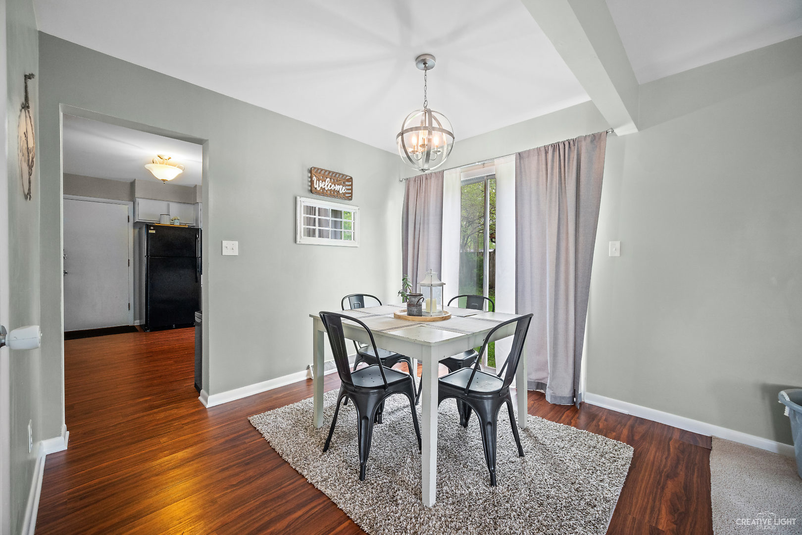 800 Russell Road DeKalb, IL 60115 - Photo 5 of 19 a view of a dining room with furniture window and wooden floor
