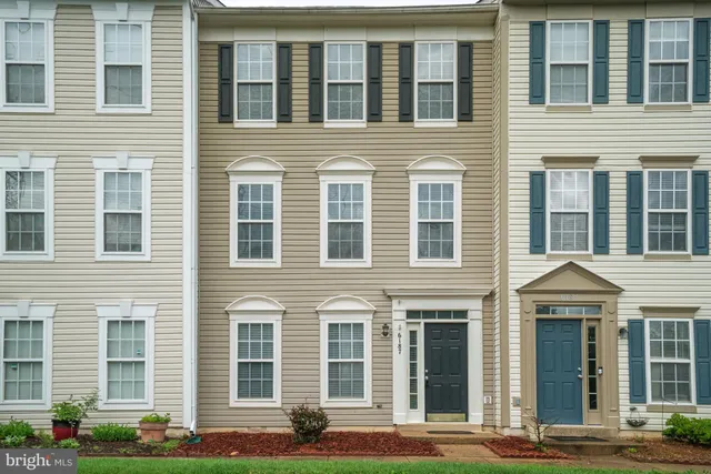 a front view of a brick house with windows