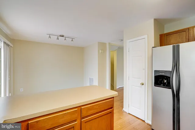 a room with a refrigerator and a stove