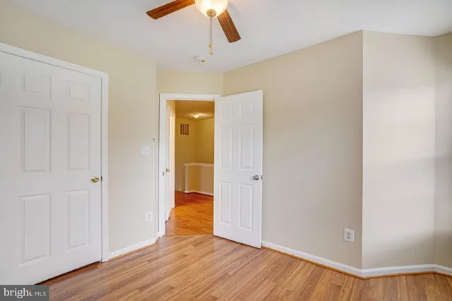 a view of hallway with wooden floor