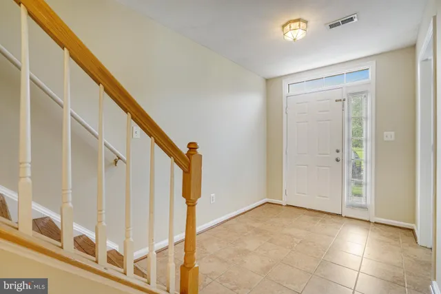 a view of entryway with stairs