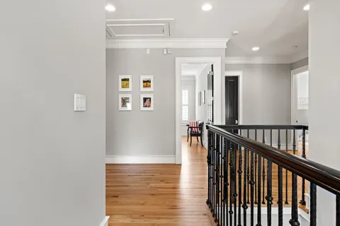 a view of gallery with wooden floor