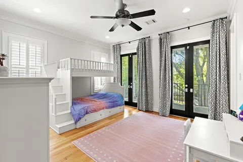a bedroom with a bed dresser and a window