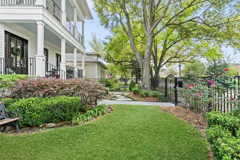 a view of a house with a yard and garden